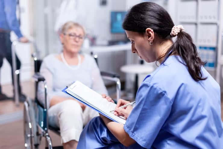 Nurse Writing Prescription for Patient