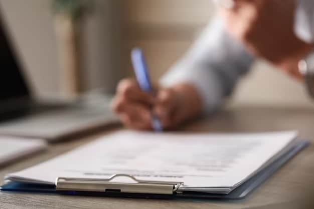 A man signs documents with a pen