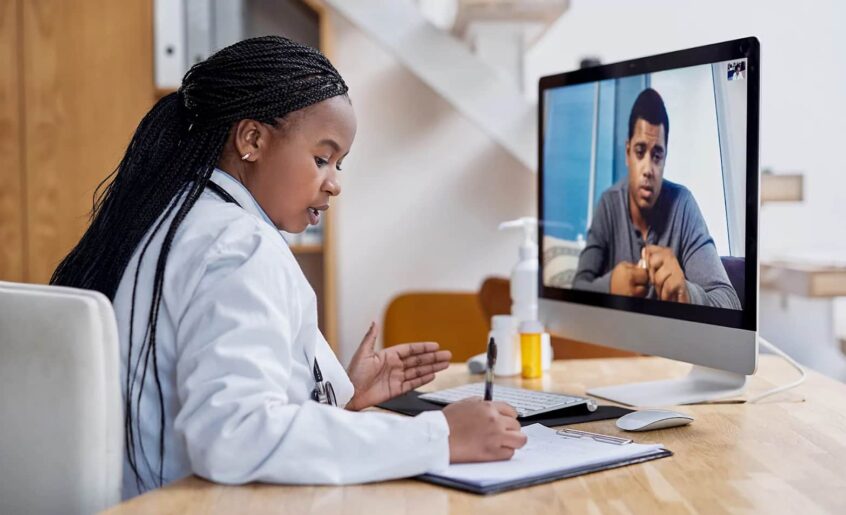 A doctor talking to a patient online