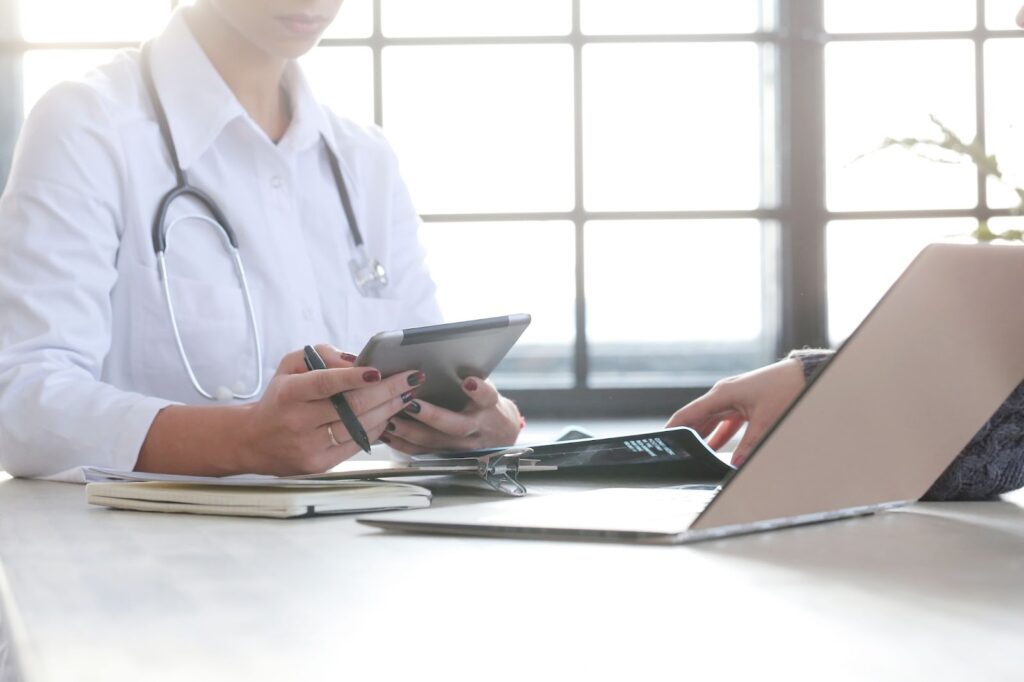 Female doctor working with tablet