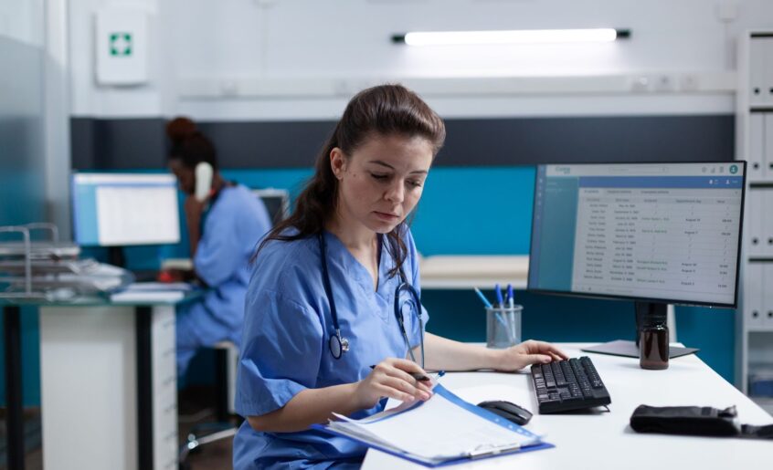 Pharmacist nurse with stethoscope analyzing data